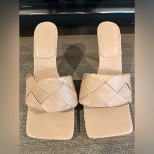 Neutral heeled mules. Trendy basket weave.